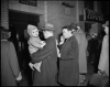 Passengers waiting to board a train in the concourse of the St. Paul Union Depot.