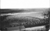 Black and white photograph of the the Dakota concentration camp on the river flats below Fort Snelling, c.1862–1863.