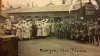 Black and white group photograph taken outside a Red Cross hut by Red Cross worker Julia Gray, 1919. 