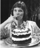 Black and white photograph of Bake-Off Grand Prize Winner Julie Konecne (Bemidji, MN) tasting her chocolate pecan praline layer cake, 1988.