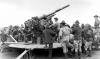 Black and white photograph of soldiers of the newly formed 215th Coast Artillery Regiment at Camp Ripley, 1940.