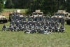 Color image of a platoon of the 34th Military Police Company, 34th Infantry Division, during annual field training at Camp Ripley, June 2016. 