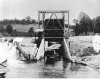 photograph of a steamboat going through a lock on the Pelican River