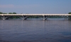 Color image of the Anoka–Champlin Mississippi River Bridge carrying U.S. Route 169, 2013. Photographed by Wikimedia Commons user McGhiever. 