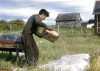 Jim Drift winnowing wild rice at Nett Lake
