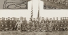 Black and white photograph of Minnesota Motor Corps officers and color guard at Camp Lakeview, Lake City, Minnesota, September, 1918. Motor Corps commander, Colonel Stephens, is kneeling left of the colors in the light colored tunic.