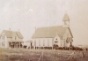 Black and white photograph of the dedication ceremony of the Immaculate Heart of Mary Catholic Church in Currie, held on September 23, 1883.