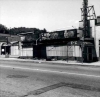 Black and white photograph of boarded-up storefronts on Plymouth Avenue in North Minneapolis, July 1967. Photographed by Twiggs.