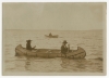 Black-and-white photograph of an Ojibwe birch bark canoe and two paddlers c.1910.