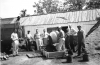 Black and white photograph of men working on a fair building at the Murray County Fairgrounds in Slayton, 1950s.