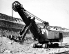 Black and white photograph of an electric shovel in operation at the Mesabi Mountain open pit mine in Franklin, ca. 1935. Photographed by Kurt B. Florman.