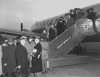 Black and white photograph of passengers boarding a Northwest Airlines plane, c.1946. Photographed by Philip C. Dittes.