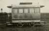 Black and white photograph of St. Paul City Railway horsecar number one at Snelling Shops storage shed prior to reconditioning for the fiftieth anniversary of the opening of the first horsecar line in St. Paul, 1922.