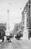 Black and white photograph of a celebration on Sixth Street West in St. Paul on the occasion of the completion of the Great Northern Railway, 1893. Photograph by T. W. Ingersoll.