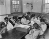 Black and white photograph of members of a sewing class at St. Paul’s Neighborhood House, c.1920.