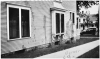 Black and white photograph of Frederick A. Scherf's home splattered with paint. 