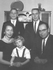 Black and white photograph of Ernotte and Ardis Hiller (seated), holding Mary Hiller; in the back are Chuck Hiller (right) and Jeff Hiller (left), 1961.