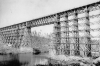 High bridge over the Kettle River near Sandstone, before September 1, 1894, and after the trees in the area were cut down by a logging company, which left highly flammable debris (slash) to serve as fire fuel. Photograph Collection, Sandstone History and Art Center, Sandstone.