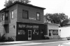 Black and white photograph of U-Meet-Us, Black Senior Citizens Lounge, and Minneapolis Urban League, East 38th St and 4th Ave, Minneapolis, 1975.