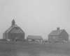 Black and white photograph of farm buildings at the State School, 1905.