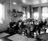 Black and white photograph of the interior of Cottage One at the State School, c.1900.