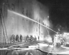 Black and white photograph of firefighters fighting the blaze at St. Paul's Temple of Aaron in 1952.