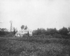 Black and white photograph of a Minnesota farm house, ca. 1890.