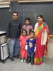 Color image of students in a Malayalam class (level 1) pose for a photograph at the School of India for Languages and Culture (SILC) on Social Studies Day, ca. 2015, in St. Paul. 