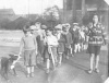 Group of children being escorted by School Police.