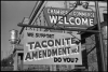 A sign outside a business promoting a “yes” vote on the taconite amendment, 1964.