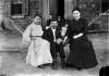 William Spangenberg seated with friends in a hammock