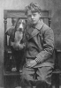 Black and white photograph of Charles Lindbergh with his dog "Dingo," c.1912. 