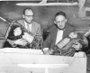 Rabbis Herman M. Cohen and Bernard S. Raskas prepare burned sacred articles for burial at the Temple of Aaron fire site, Ashland and Grotto, St. Paul.