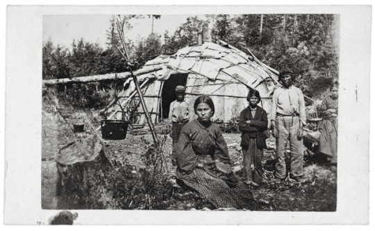 Black and white photograph of Ojibwe family, c.1860. 