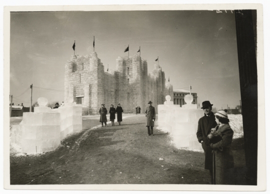 Black and white photograph of the 1937 Winter Carnival Ice Palace, looking west toward State Office Building.