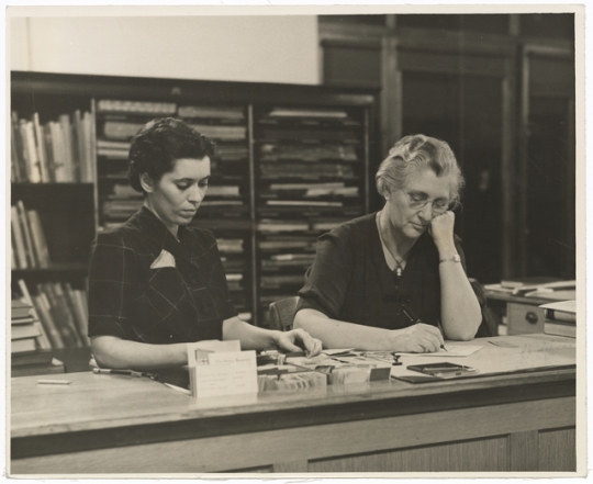 Gratia A. Countryman at desk in Minneapolis Public Library