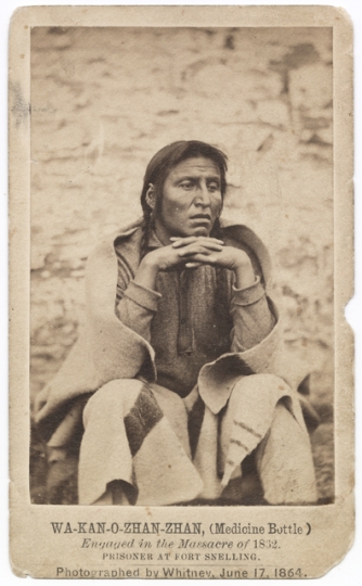 Black and white photograph of Dakota leader Wakan Ozanzan(Medicine Bottle) at Fort Snelling, 1864.