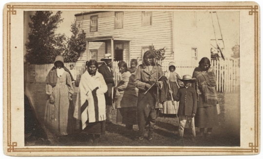 Black and white photograph of Dakota Indians at Williamson home (Pajutazee Mission) near Yellow Medicine, 1862.