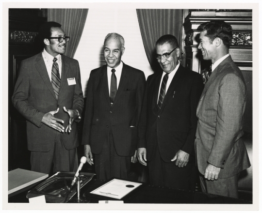 1975 Photograph of Roy Wilkins, Samuel Richardson, Governor Wendell Anderson and an unidentified man.