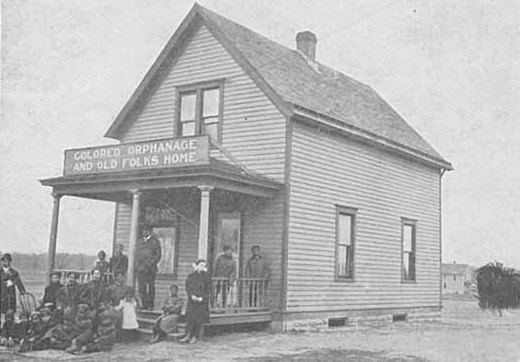 Black and white photograph of the Crispus Attucks Orphanage and Old Folks Home at its original location on East Acker Street in St. Paul, c.1905.