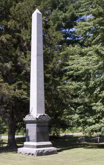 Color image of the obelisk monument in Brook Park Cemetery commemorating the victims of the 1894 fire, August 7, 2017. Photograph by Alan W. Slacter.