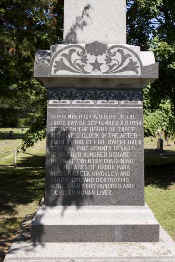 Color image of the base of an obelisk monument in Brook Park commemorating the victims of the 1894 fire, August 7, 2017. Photograph by Alan W. Slacter.