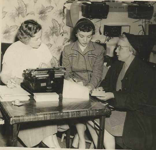 Black and white photograph of Crookston BPW members selling Artist Series tickets, 1954.
