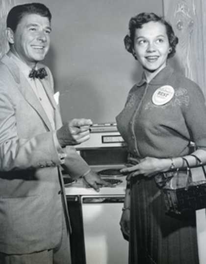Black and white photograph of Beatrice Ojakangas from Duluth, MN and Ronald Reagan at the Bake-Off in Los Angeles, 1957.