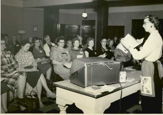 Black and white photograph of Lois Fankhanel teaching a class at a workshop for Farm Bureau women, 1960.