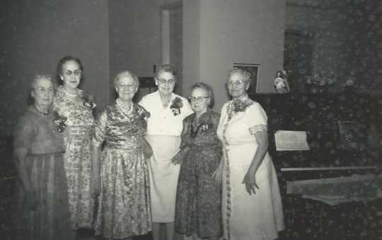 Black and white photograph of BPWC’s original charter members at the club’s fortieth anniversary celebration, 1961. Pictured (left to right) are Anna Brustad, Pauline Lohn, Mae Rideout, Ida Twedten, Sue Monroe, and Dr. Blanche Sharp.