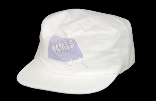 Color image of a hat given to volunteers at the NAMES Project tour stop in Minneapolis, Minnesota, 1988.