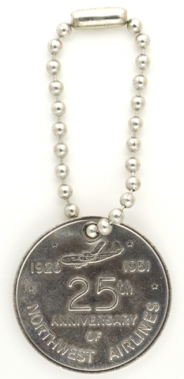 Color image of a Northwest Airlines silver anniversary medallion, 1951.