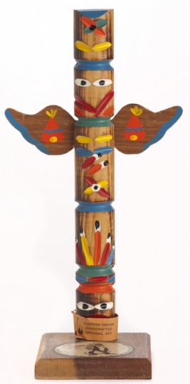 A souvenir totem pole, created ca. 1970, with a depiction of the Hamm’s bear. This piece is a good example of Hamm’s Brewing Company’s use of generic and often inaccurate Indigenous iconography in their advertising. Although this object was made by an Ojibwe family, totem-pole carving is not an Anishinaabe tradition; the art form is practiced by Indigenous groups on the West Coast of the United States and Canada, including the Haida, the Tlingit, and the Nuxalk.