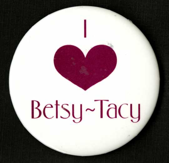 Color image of a "I love Betsy-Tacy" pinback button, manufacturer unknown, c.1990-1994.  